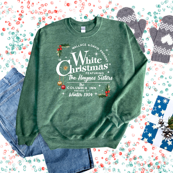 Green sweatshirt with 'White Christmas' text on a festive background with mittens and puzzle pieces.