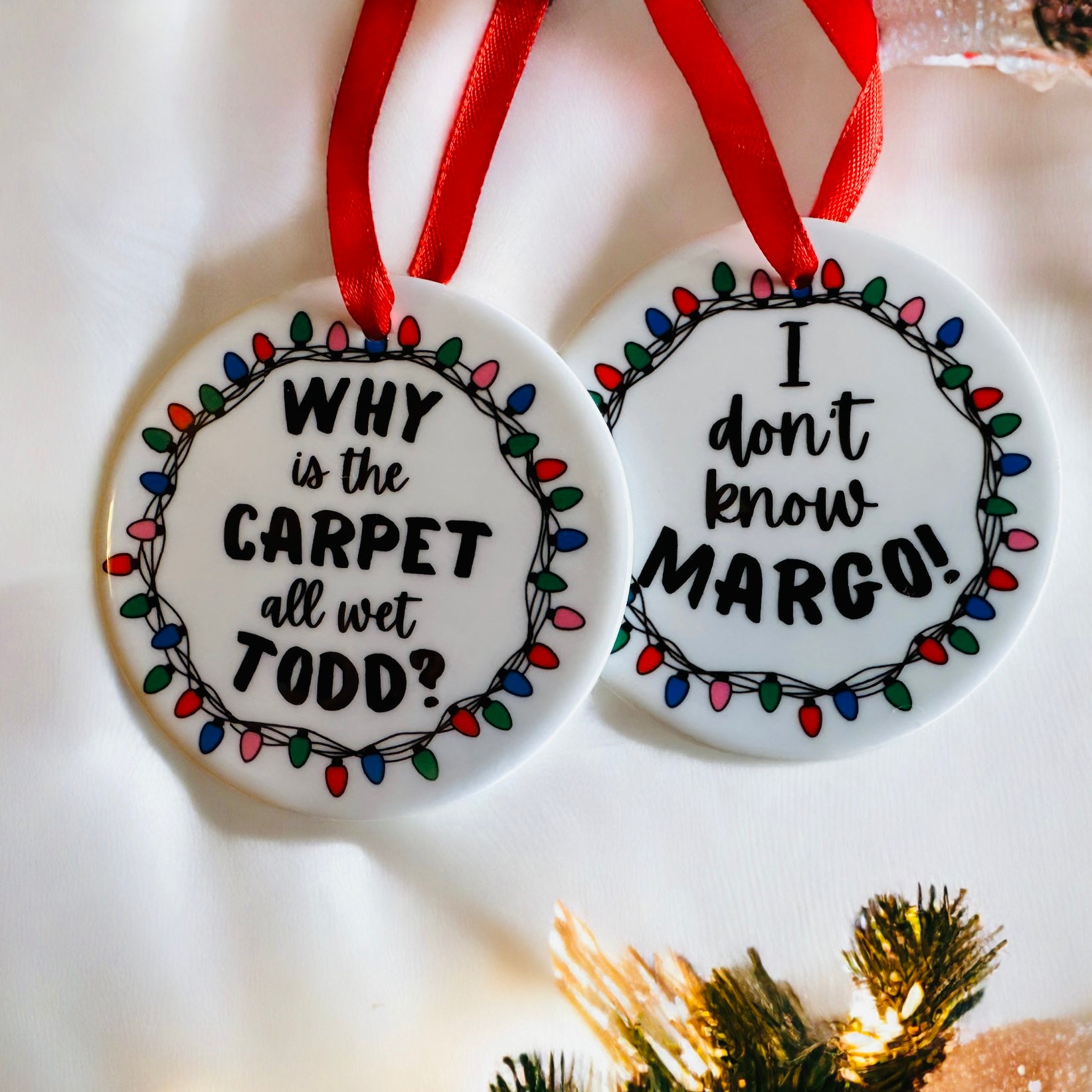 Ceramic Ornament with the saying "why is the carpet all wet todd, and the back says I dont know Margo, National Lampoons christmas vacation ornament