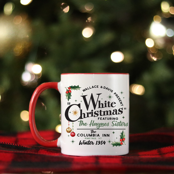 White mug with red handle featuring 'White Christmas' text against a festive background