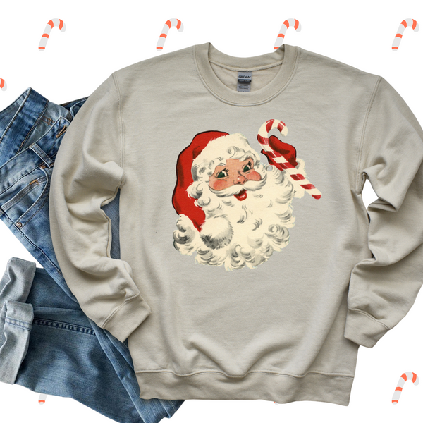 Beige sweatshirt with Santa Claus design and candy canes on a white background