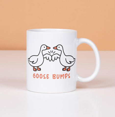 Goose Bumps mug.  2 geese first bumping