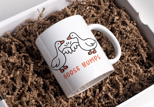 Goose Bumps mug.  2 geese first bumping
