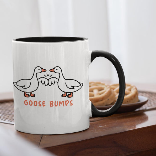 Goose Bumps mug.  2 geese first bumping