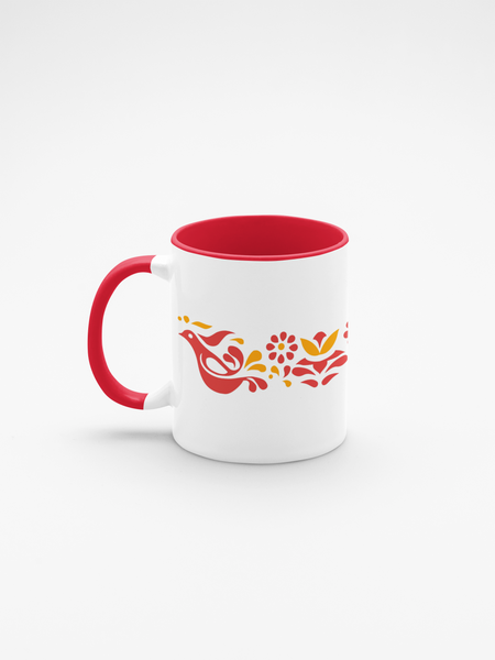 White mug with red interior and handle, featuring a colorful design on a white background