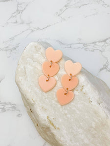 Prep Obsessed Wholesale - Acrylic Triple Heart Dangle Earrings: Blush